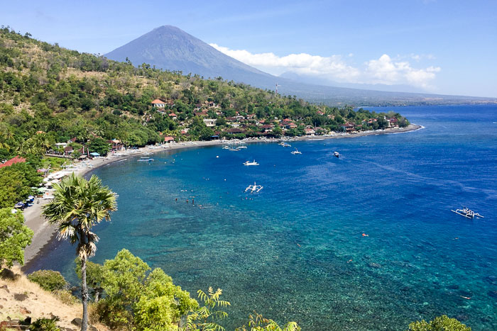Mount Agung volcanic peak towering over traditional village