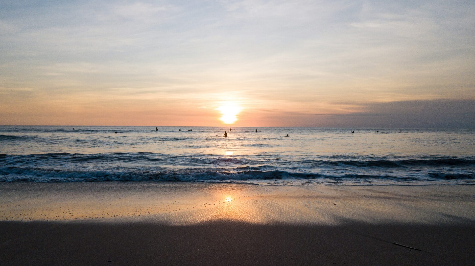 Surfer riding a wave in Bali