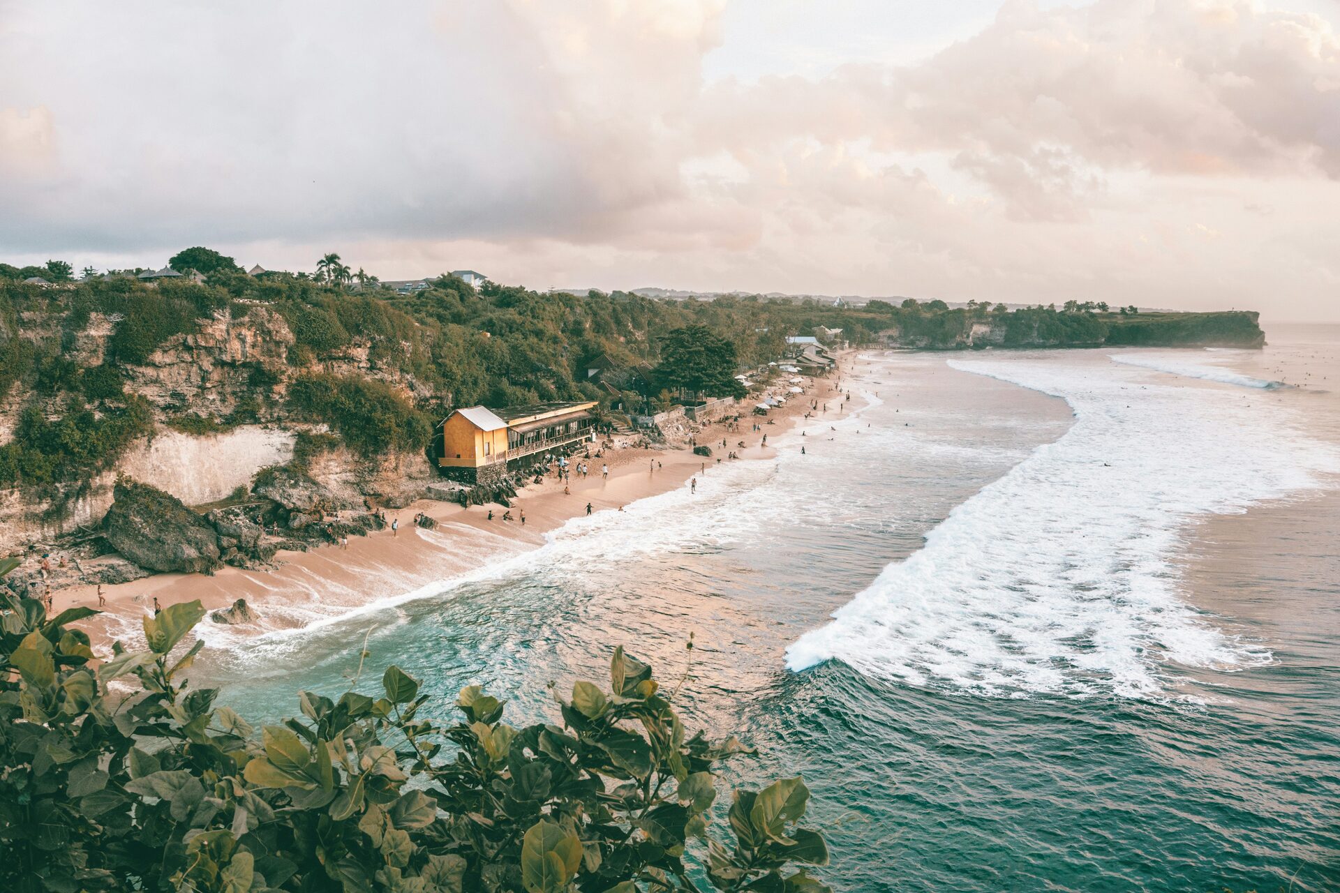 Balangan Beach — long sandy bay with cliffs and surfers, Uluwatu peninsula, Bali