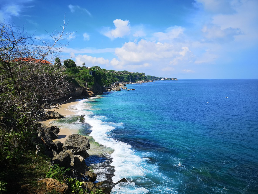 Tegal Wangi Beach — cove and cliffs above the turquoise Jimbaran coast, Bali