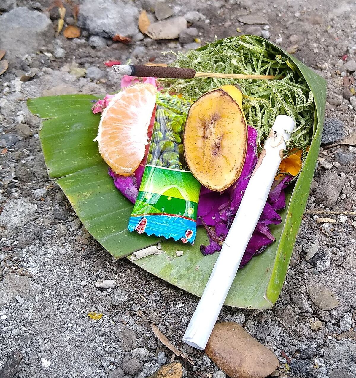 A Balinese canang sari offering made with leaves and flowers